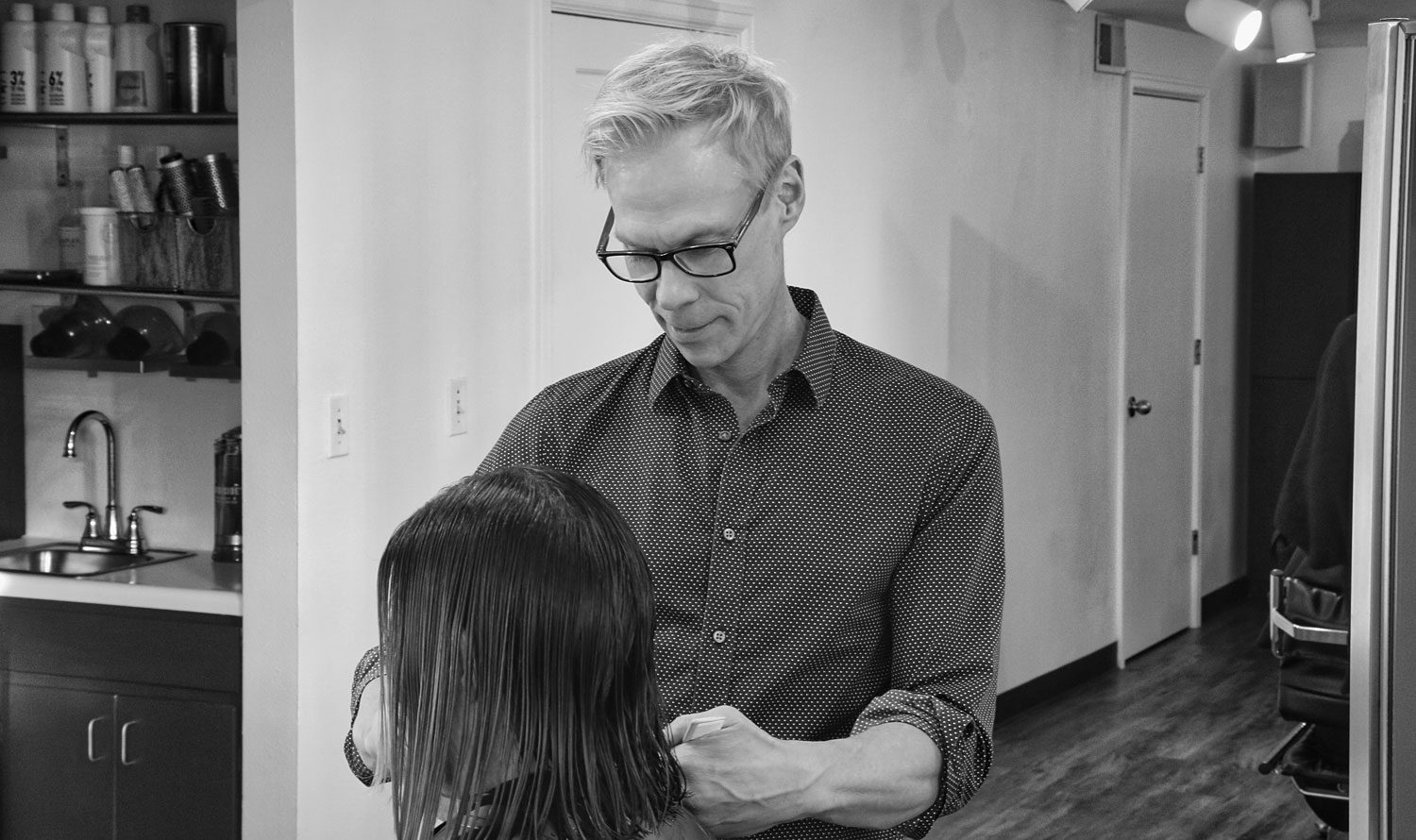 A Rumours stylist with a client